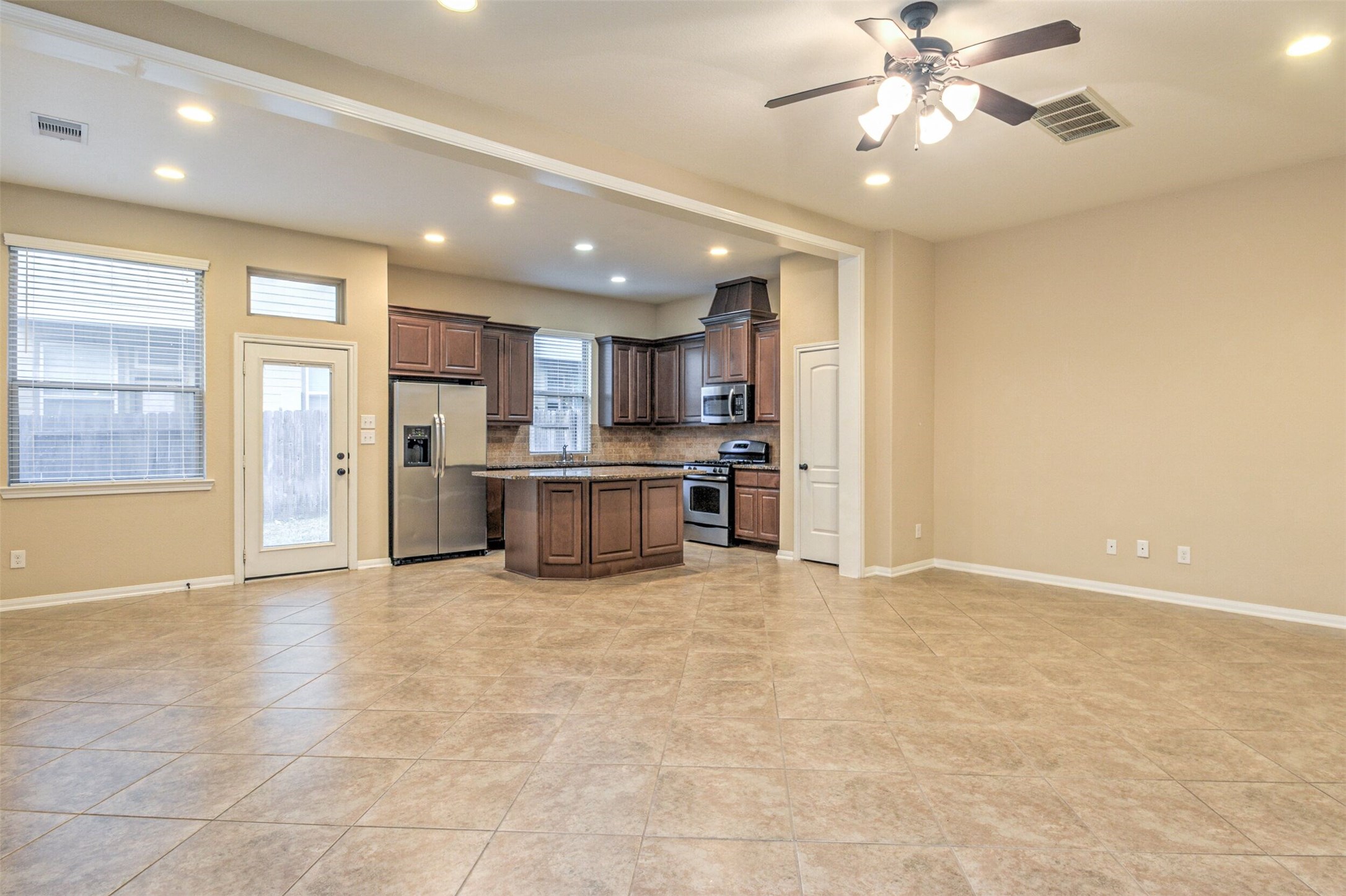 19 Cheswood Manor Court The Woodlands, TX 77382 - Photo 5 of 37 a view of a kitchen with a stove cabinets and a kitchen
