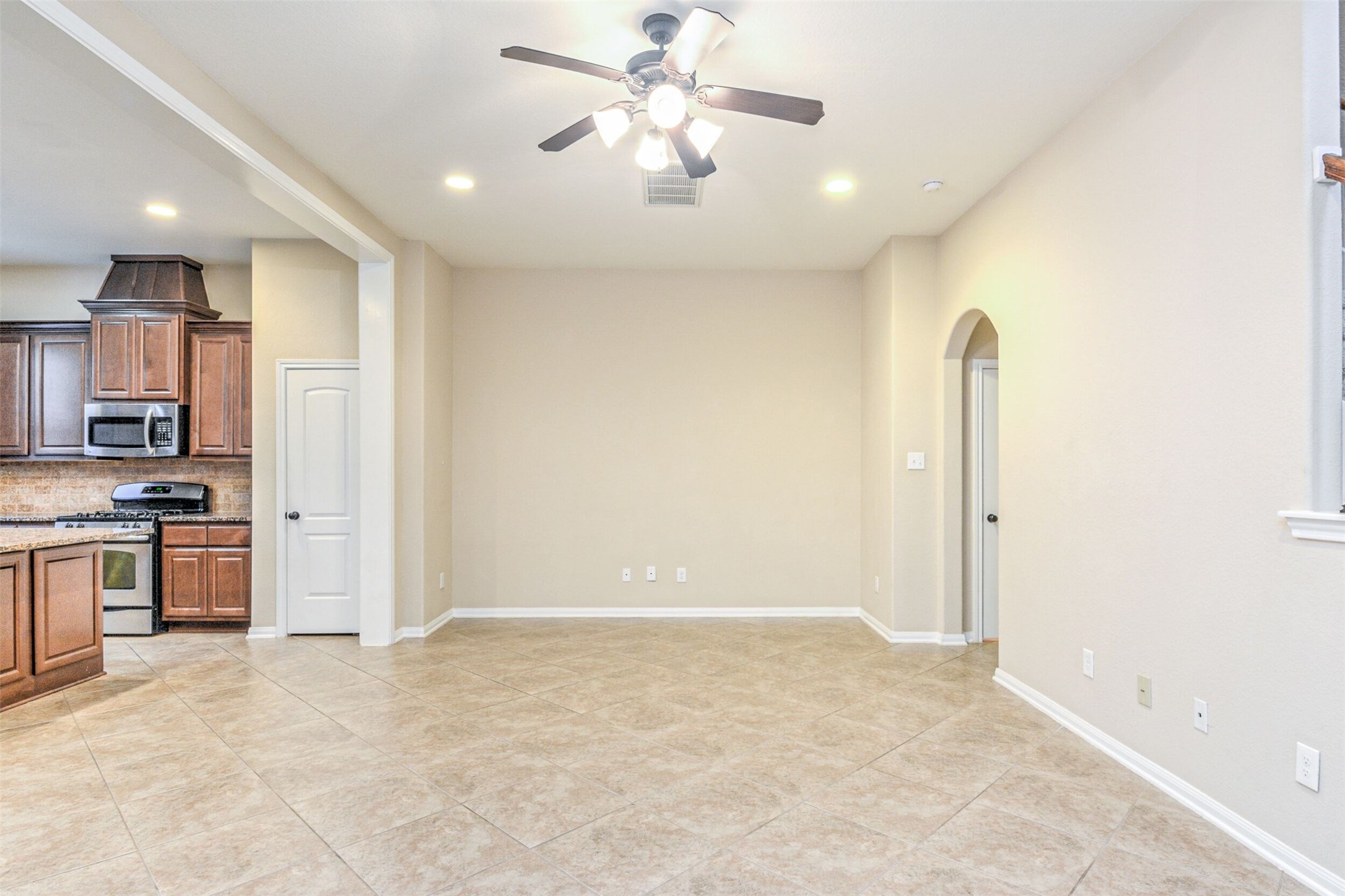 19 Cheswood Manor Court The Woodlands, TX 77382 - Photo 7 of 37 a view of a kitchen with a sink and a refrigerator