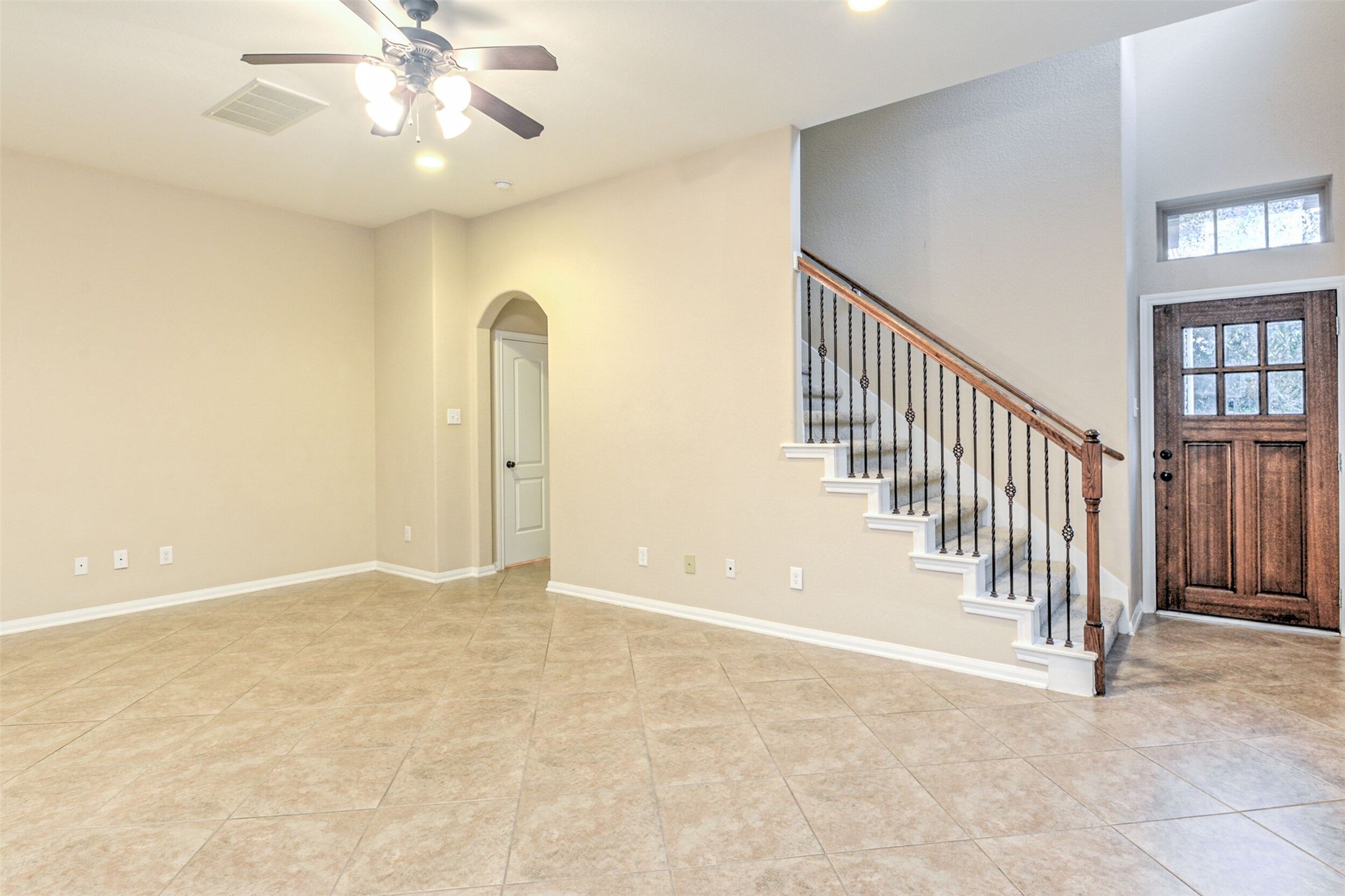 19 Cheswood Manor Court The Woodlands, TX 77382 - Photo 8 of 37 en view interior of a house with an entryway and stairs