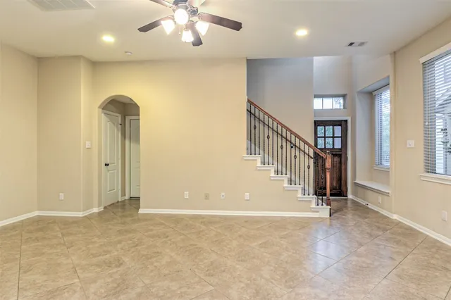 an entryway in a hall with a window