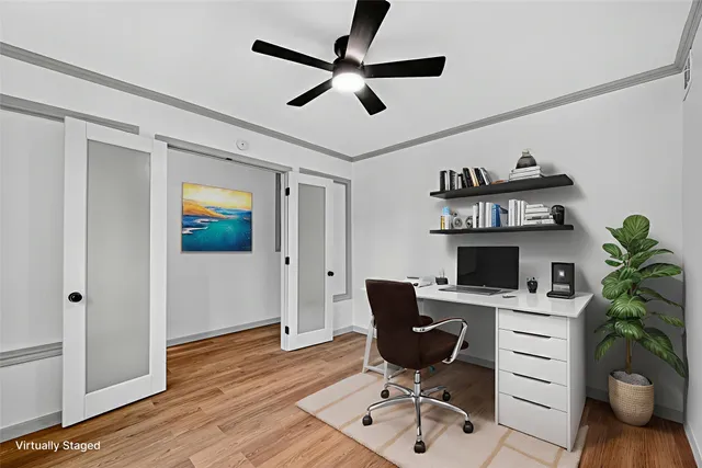 a view of a workspace with furniture and a potted plant