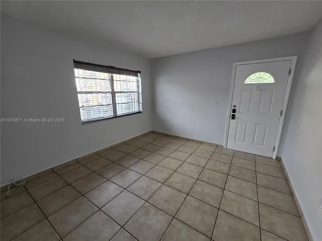 a view of an empty room and window