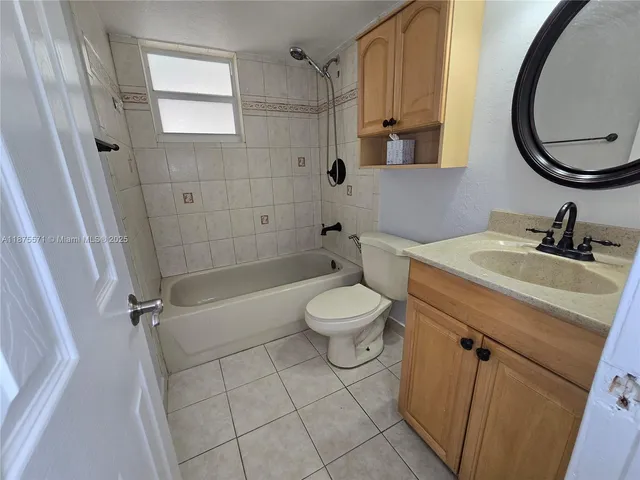 a view of a storage and utility room with a sink
