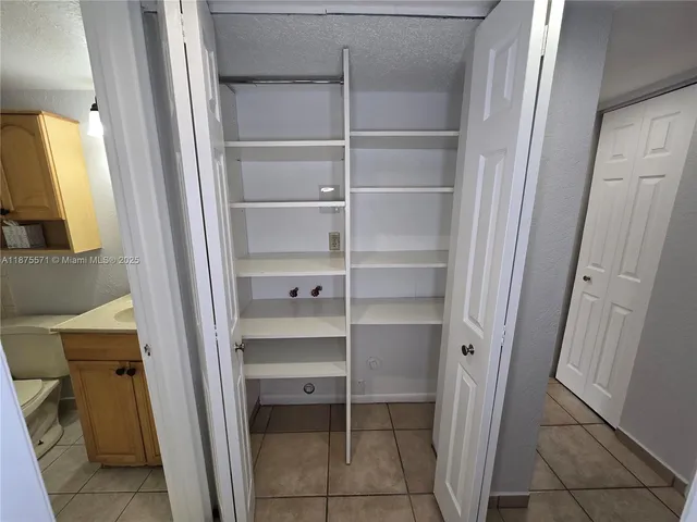 a kitchen with stainless steel appliances granite countertop a sink and a stove