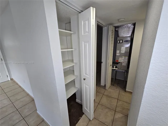 a kitchen with stainless steel appliances granite countertop a sink and a stove