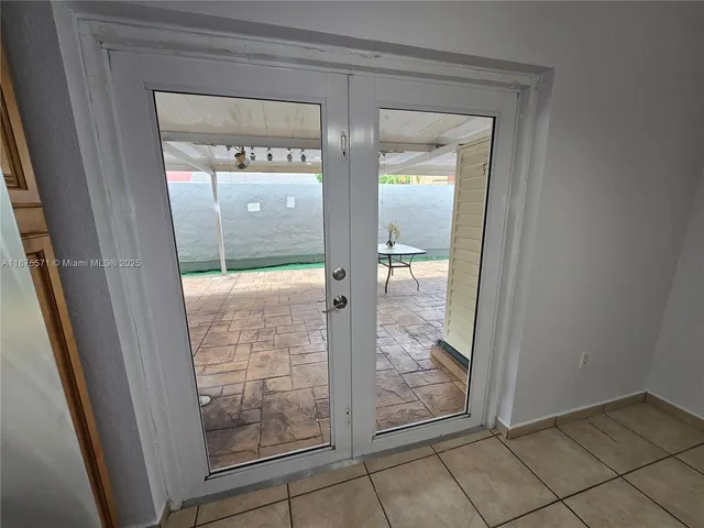 a kitchen with a stove and a sink