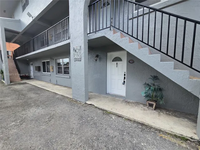 a kitchen with a sink and a stove top oven