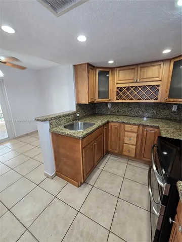 a bathroom with a sink toilet vanity and tub
