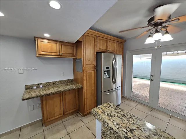 a view of an empty room and a window