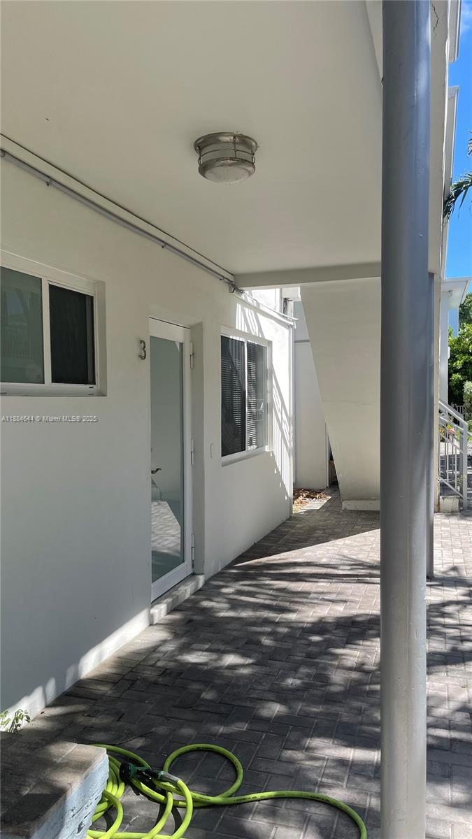320 86th Street, Unit 3 Miami Beach, FL 33141 - Photo 2 of 13 a view of bedroom with wooden floor