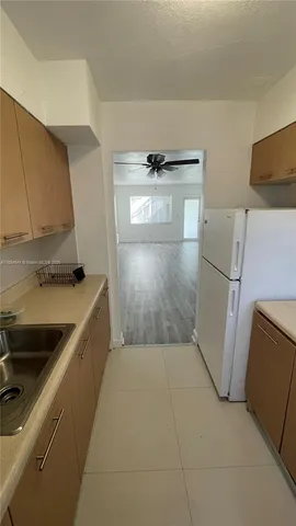 a view of a kitchen with a sink