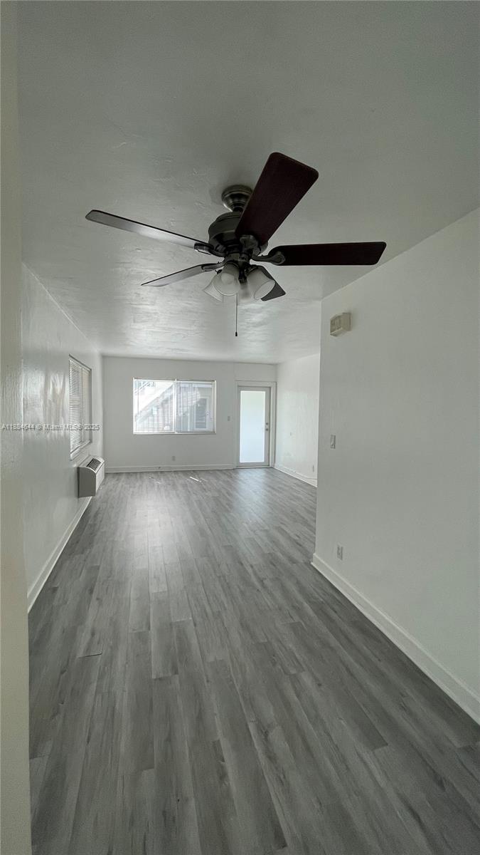 320 86th Street, Unit 3 Miami Beach, FL 33141 - Photo 7 of 13 a view of empty room with wooden floor