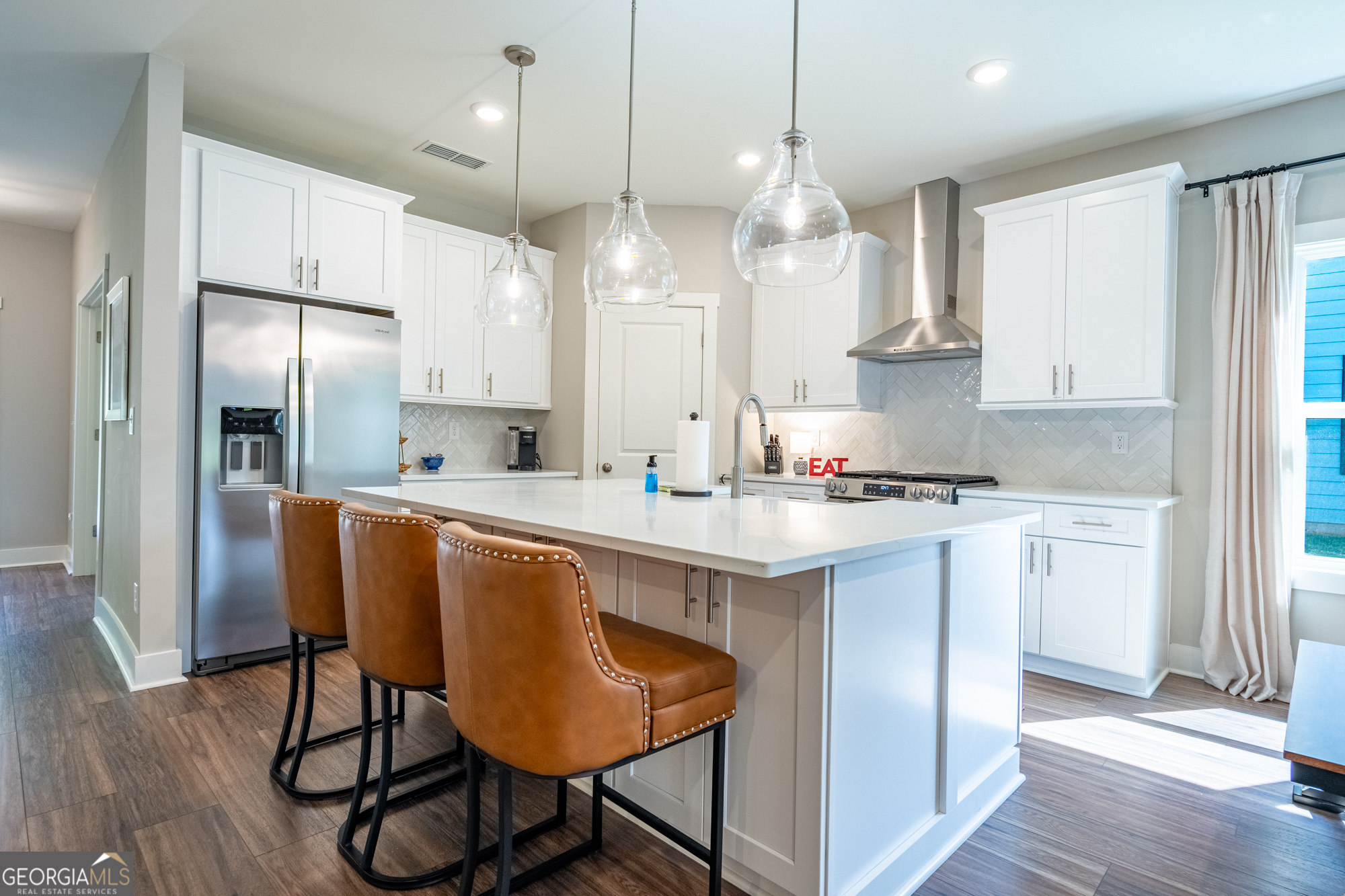 143 Old Alabama Road Southeast Emerson, GA 30137 - Photo 2 of 48 a large kitchen with stainless steel appliances granite countertop a sink a stove a refrigerator and island with wooden floor