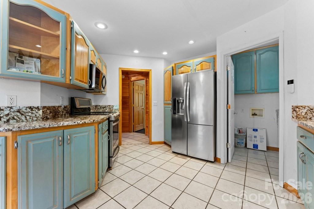 44 Elliston Court Sylva, NC 28779 - Photo 15 of 44 a kitchen with stainless steel appliances granite countertop a refrigerator and a stove top oven