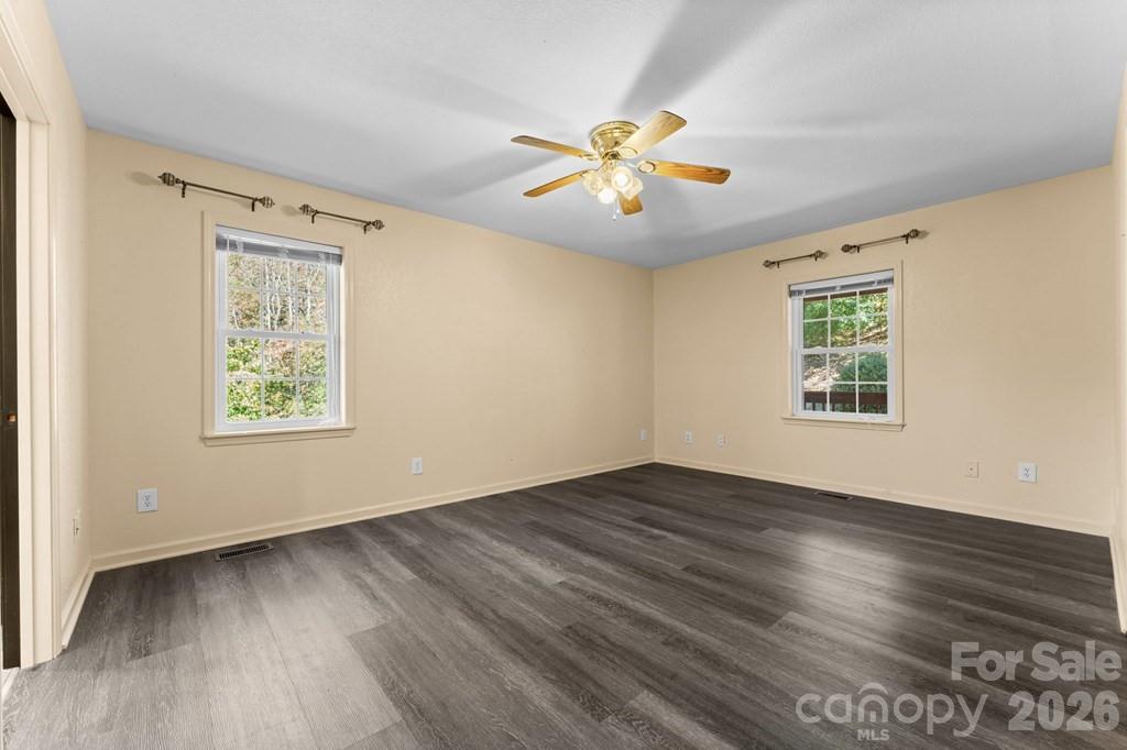 44 Elliston Court Sylva, NC 28779 - Photo 19 of 44 a view of an empty room with wooden floor and a window