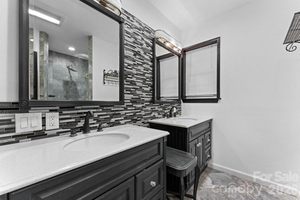 44 Elliston Court Sylva, NC 28779 - Photo 29 of 44 a bathroom with a sink and a mirror