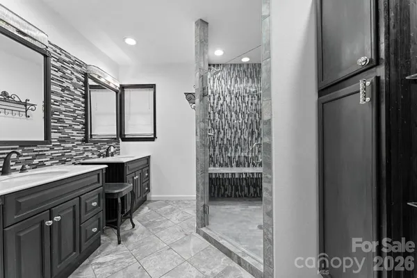 a bathroom with a shower and a sink