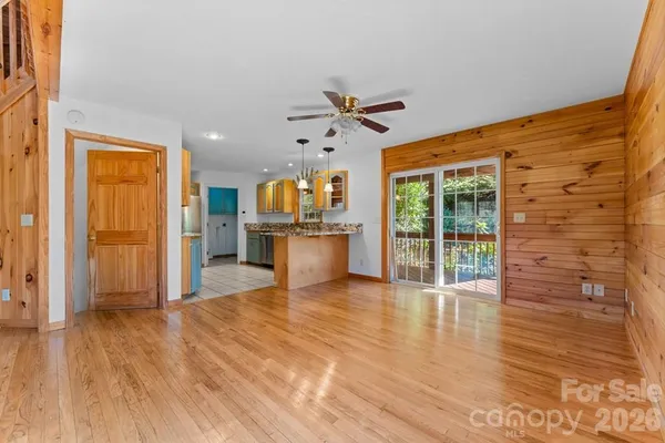 a view of a kitchen with wooden floor and a kitchen
