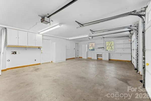 a view of empty room with wooden walls