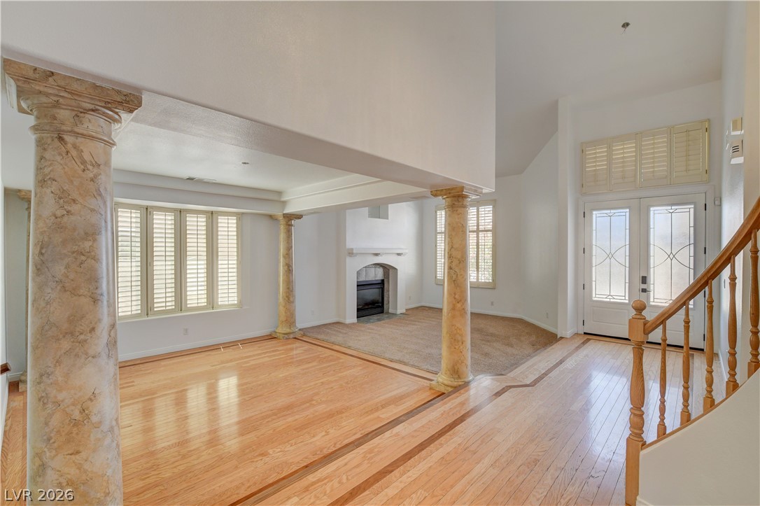 4354 Tall Tree Street Las Vegas, NV 89147 - Photo 11 of 67 This bright, airy room features gleaming hardwood floors and an inviting fireplace, perfect for gatherings.