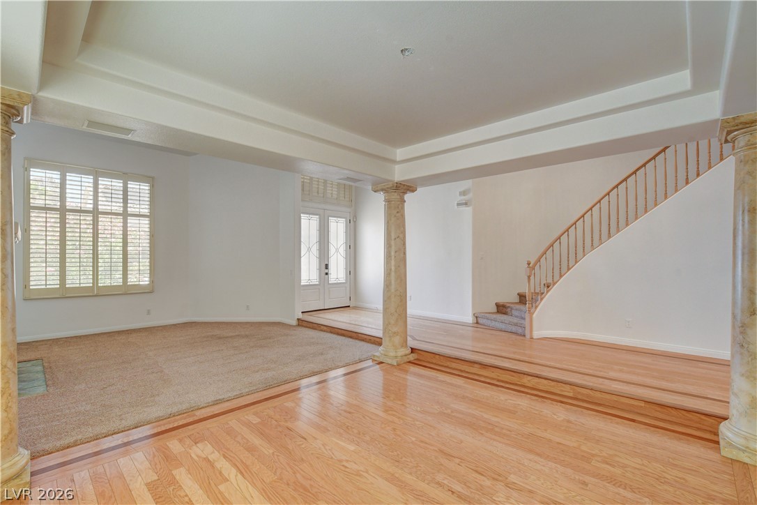 4354 Tall Tree Street Las Vegas, NV 89147 - Photo 12 of 67 This expansive space features natural light and a grand staircase.