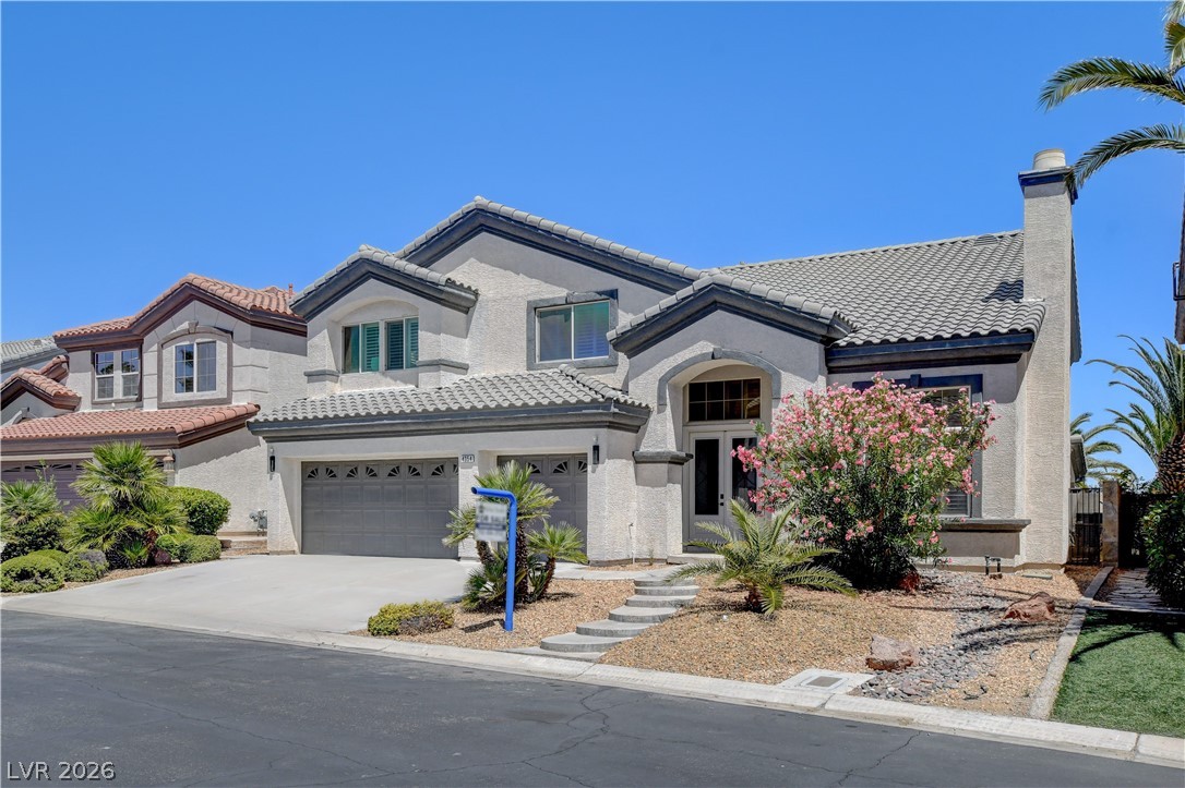 4354 Tall Tree Street Las Vegas, NV 89147 - Photo 2 of 67 This residence showcases a clean stucco exterior with a tile roof and a functional attached garage.