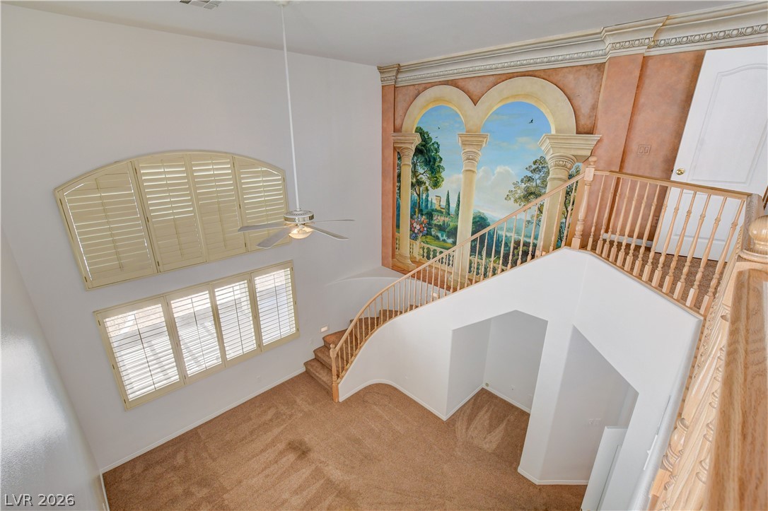 4354 Tall Tree Street Las Vegas, NV 89147 - Photo 31 of 67 This living area features vaulted ceilings, inviting an abundance of natural light and grandeur.