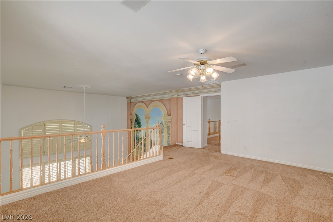 4354 Tall Tree Street Las Vegas, NV 89147 - Photo 36 of 67 This versatile loft area offers additional living space with architectural details.