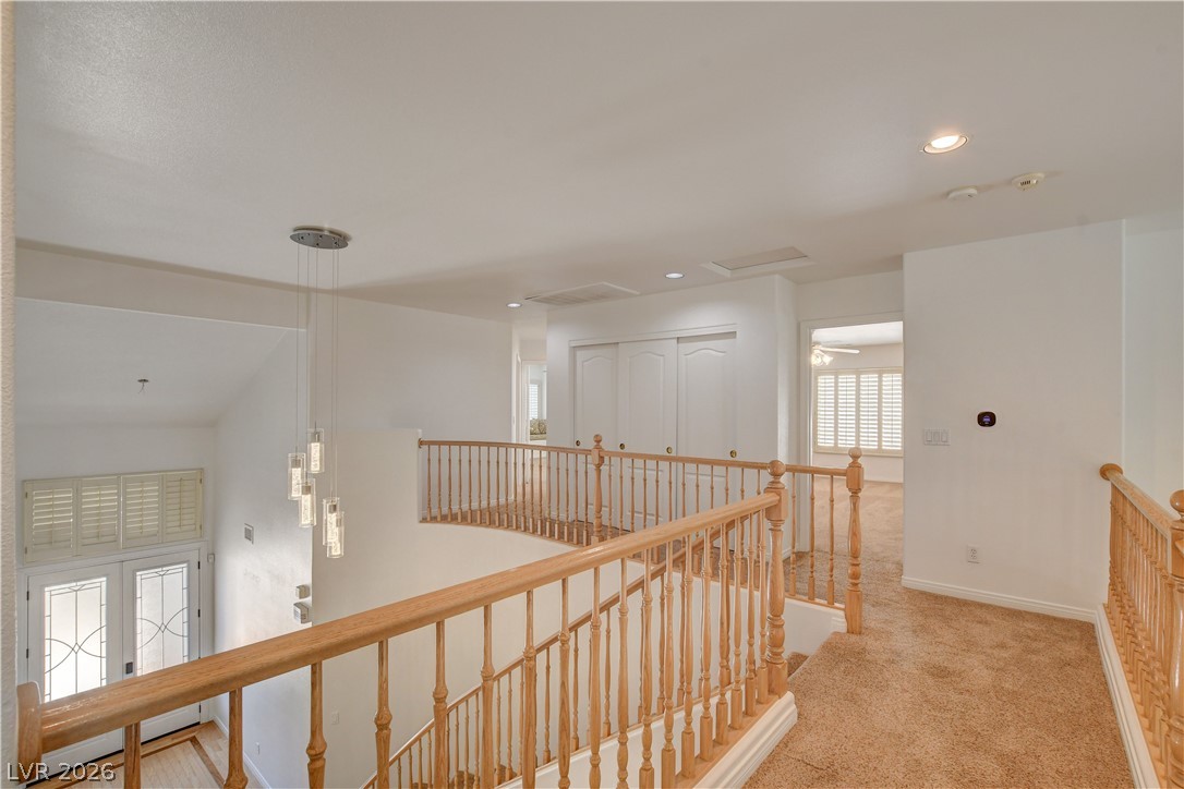 4354 Tall Tree Street Las Vegas, NV 89147 - Photo 44 of 67 This spacious interior features a grand staircase and a welcoming entryway.