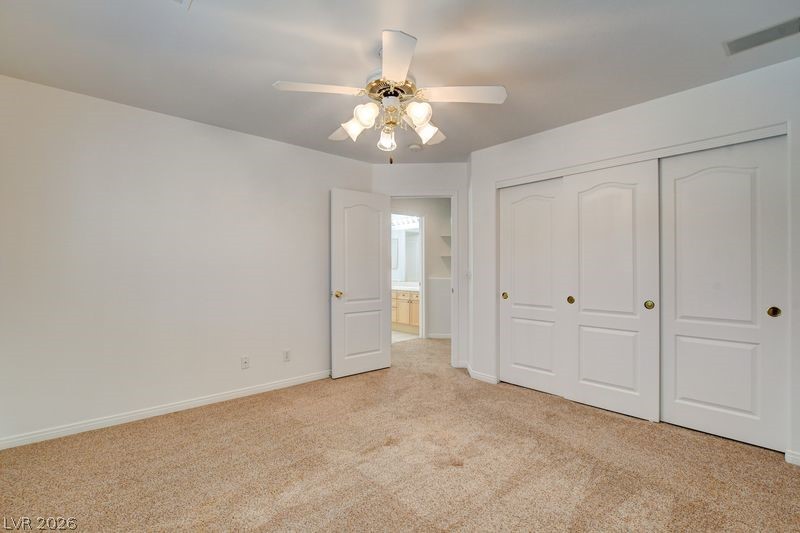 4354 Tall Tree Street Las Vegas, NV 89147 - Photo 47 of 67 This spacious room features ample storage and a refreshing overhead fan, perfect for relaxation.
