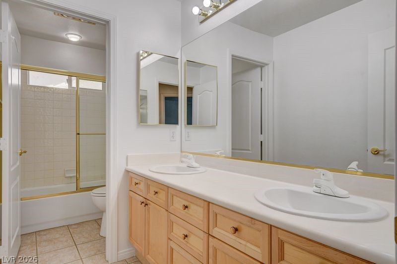 4354 Tall Tree Street Las Vegas, NV 89147 - Photo 48 of 67 This bathroom features a double vanity and a combination shower-tub.