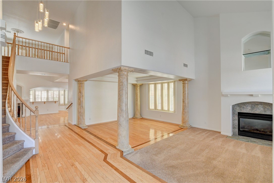4354 Tall Tree Street Las Vegas, NV 89147 - Photo 5 of 67 Grand foyer with a winding staircase and elegant living area.