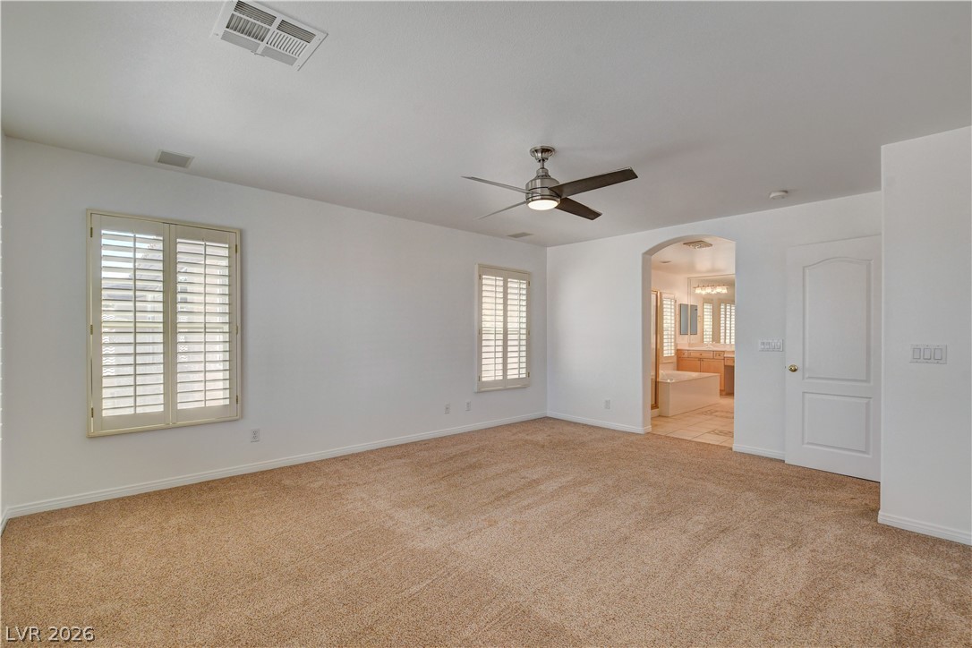 4354 Tall Tree Street Las Vegas, NV 89147 - Photo 52 of 67 This expansive room offers a clear transition to a bathroom, perfect for seamless daily routines.