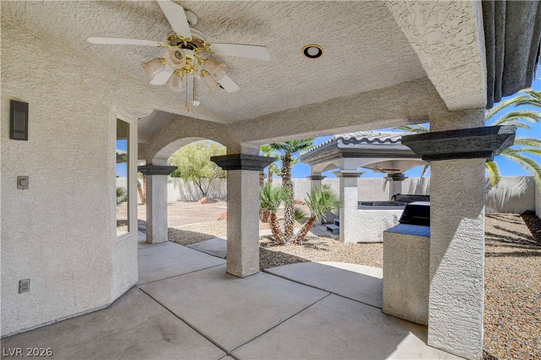 4354 Tall Tree Street Las Vegas, NV 89147 - Photo 58 of 67 An inviting covered patio featuring an outdoor kitchen, perfect for alfresco dining.