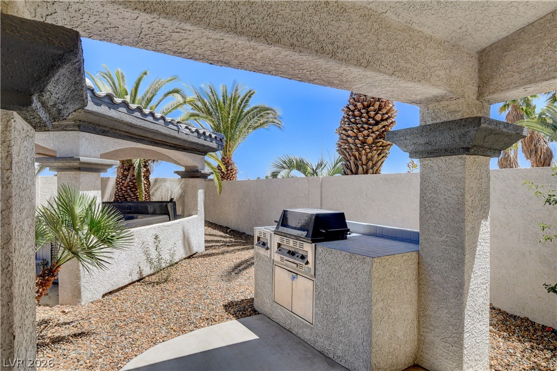 4354 Tall Tree Street Las Vegas, NV 89147 - Photo 60 of 67 This private outdoor living space offers an inviting oasis for relaxation and entertainment.