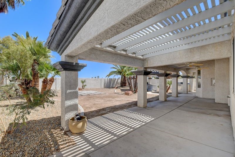 4354 Tall Tree Street Las Vegas, NV 89147 - Photo 61 of 67 This outdoor patio features a pergola and concrete flooring, offering a perfect space for relaxation.