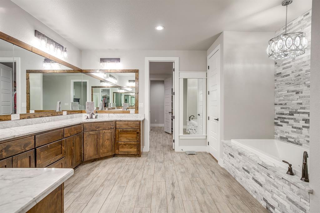 8895 Hutcheson Hill Road Springtown, TX 76082 - Photo 17 of 40 Master Bathroom with jetted tub large walk in shower and double vanities