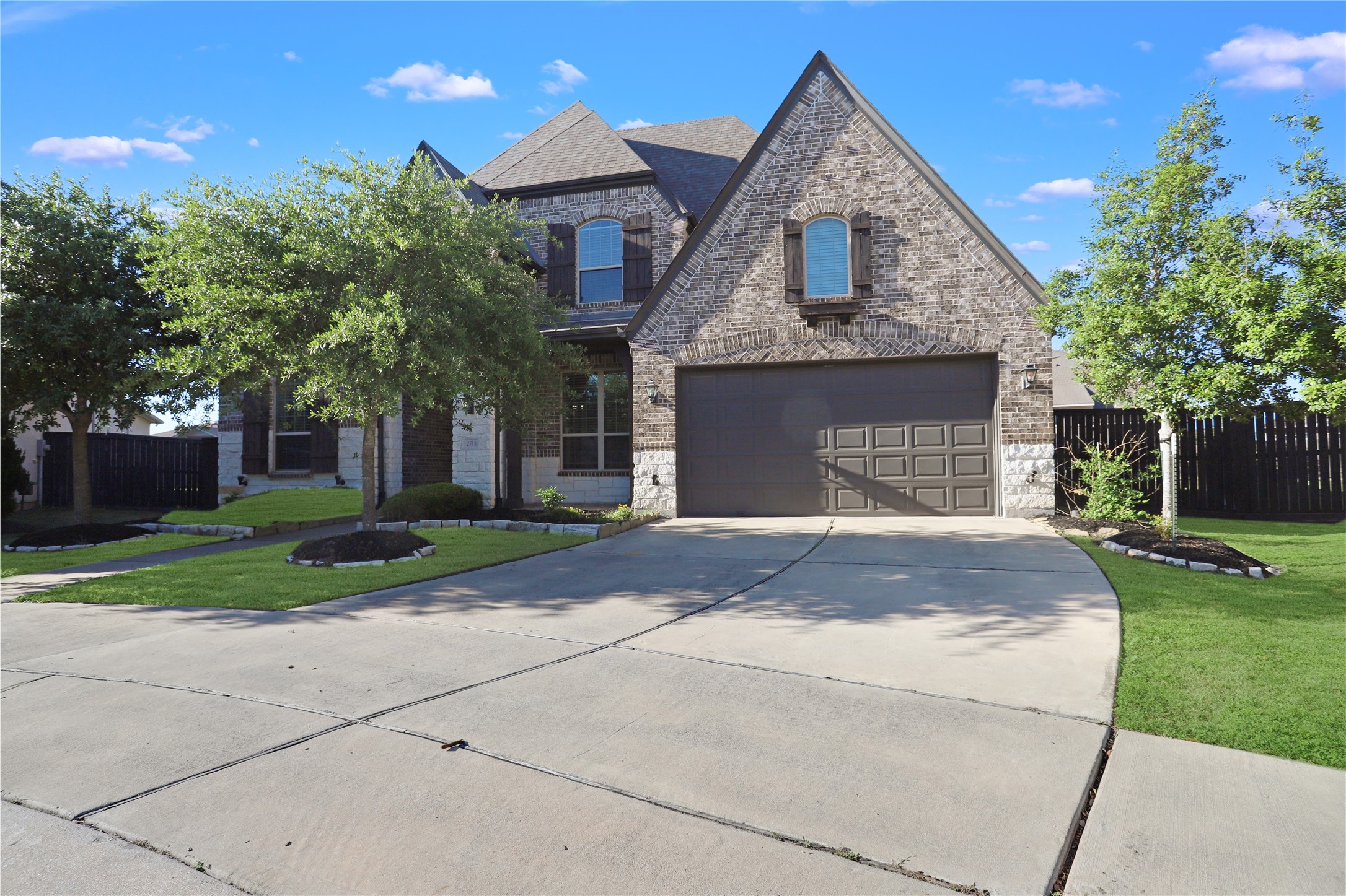 2718 Ripe Amber Cup Court Richmond, TX 77406 - Photo 40 of 43 a front view of a house with a garden