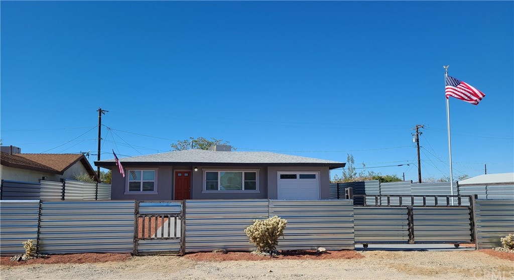 62058 Bonair Road Joshua Tree, CA 92252 - Photo 1 of 1 a front view of a house with a street