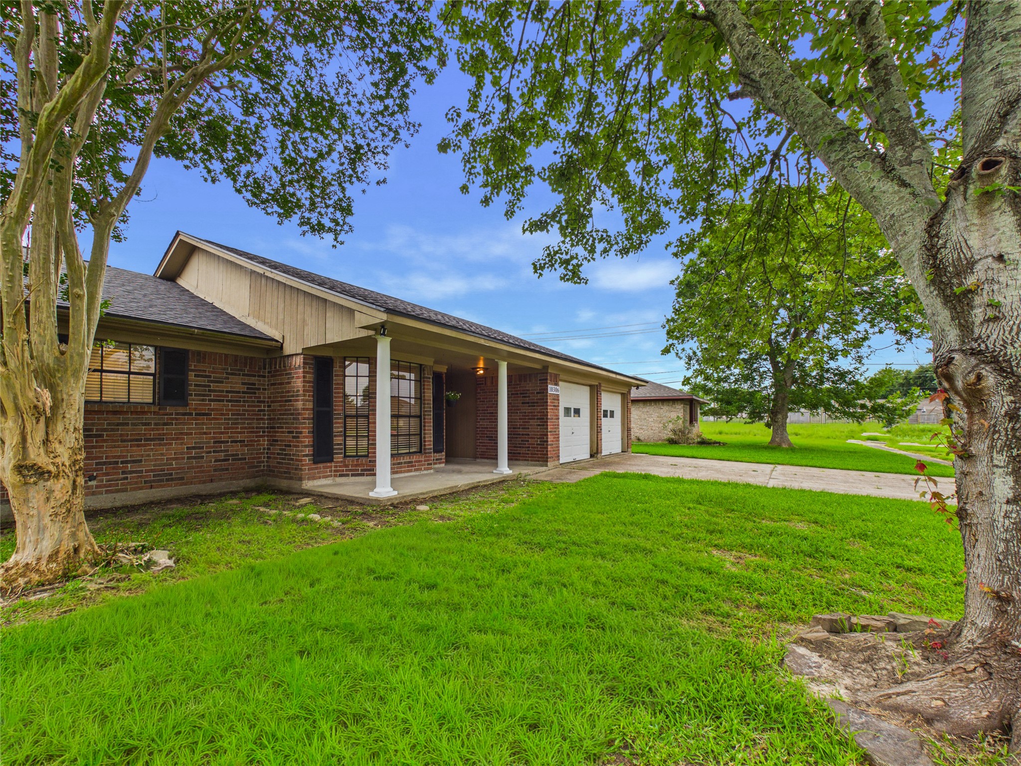 10306 Rustic Rock Road La Porte, TX 77571 - Photo 3 of 38 a view of a house with a yard