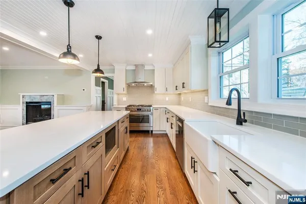 a kitchen with cabinets a sink and appliances
