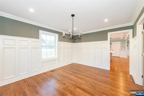 a room with a fireplace and a large window