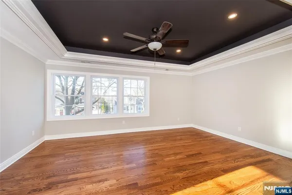 a view of a room with rack on the wall and a window