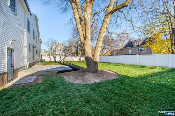 a brick house with a yard