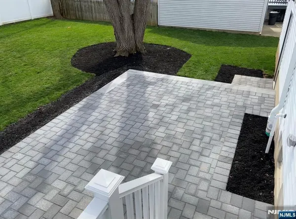 a view of backyard with swimming pool