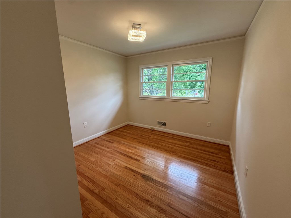 2304 Poplar Lane Anderson, SC 29621 - Photo 21 of 33 This bright room features warm hardwood floors and ample natural light through a large window.
