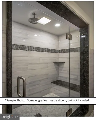 a picture of a bathroom with a shower