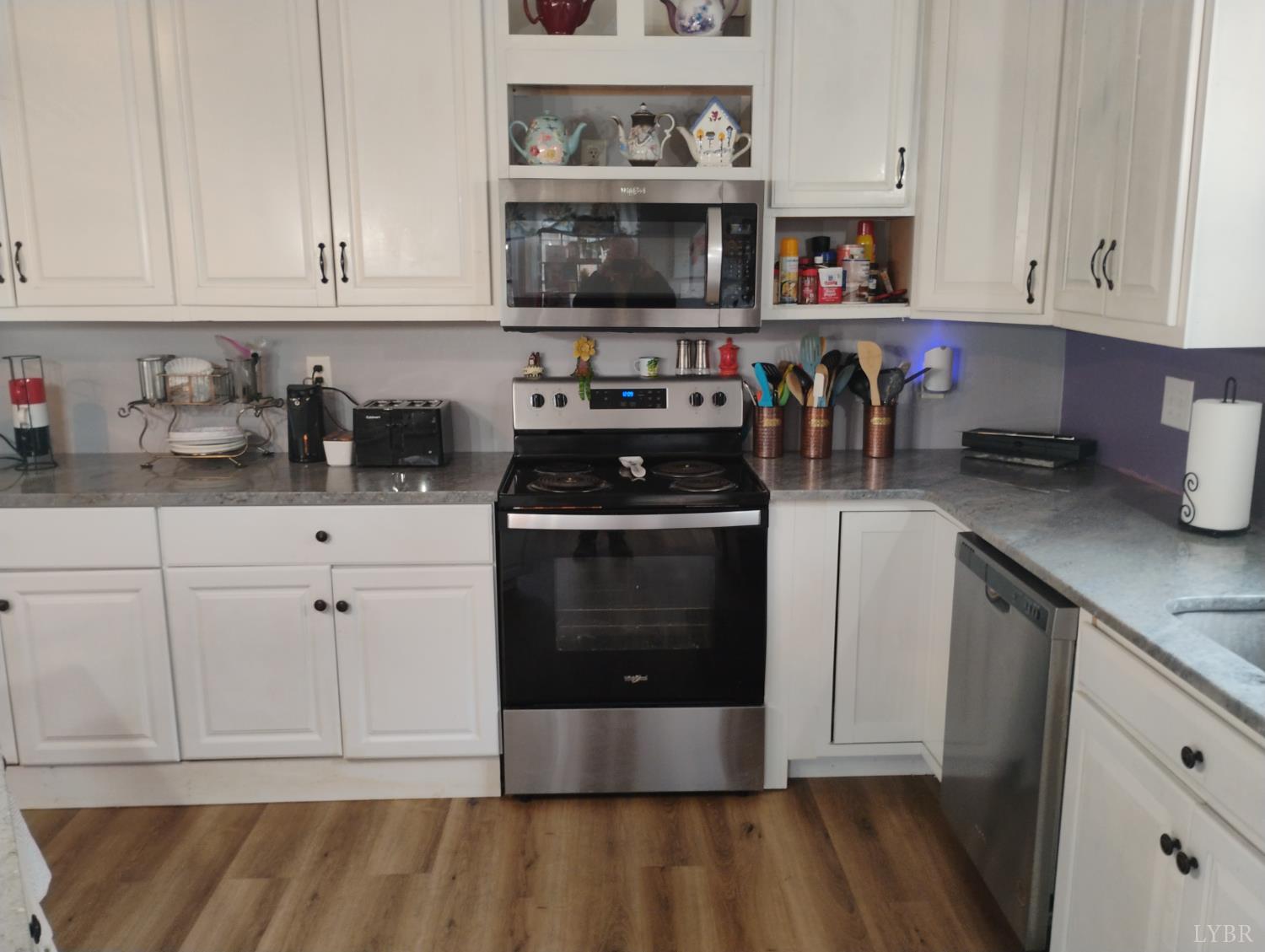 4183 Tye River Road Amherst, VA 24521 - Photo 14 of 67 a kitchen with stainless steel appliances granite countertop a stove a sink and a white cabinets