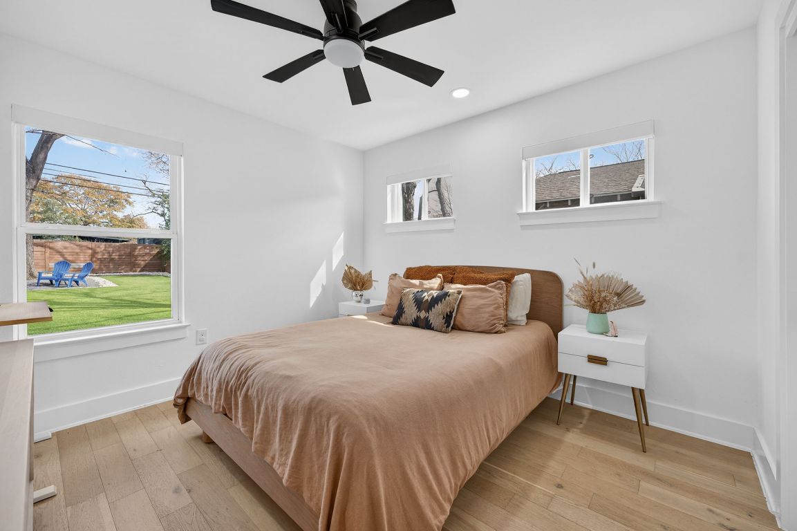 504 West Croslin Street Austin, TX 78752 - Photo 14 of 22 a bedroom with a bed and a painting on the wall