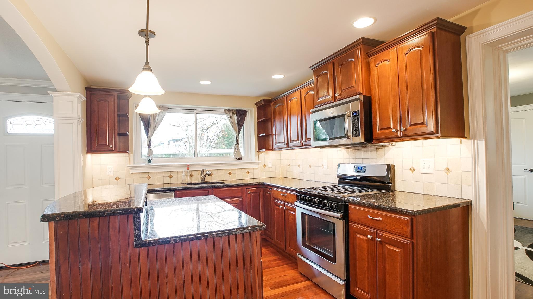 2026 Berkley Road Norristown, PA 19403 - Photo 9 of 31 Kitchen center island with bar height seating.